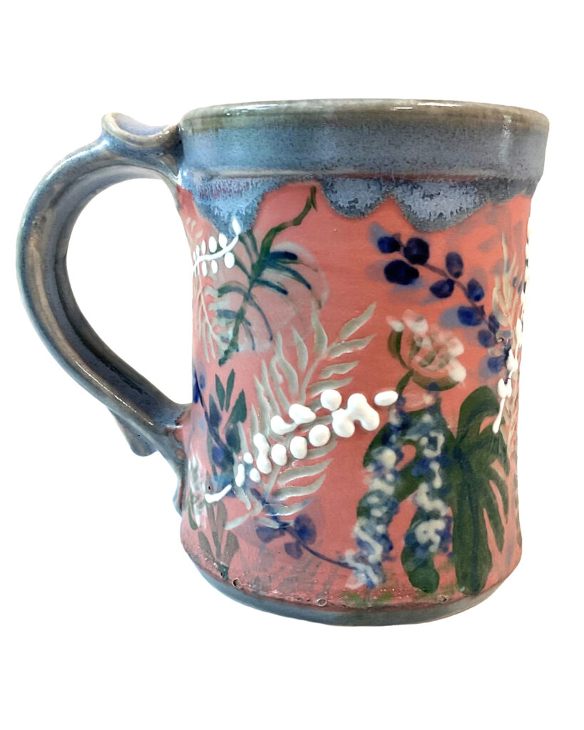 Custom mug with leaf print and handle.