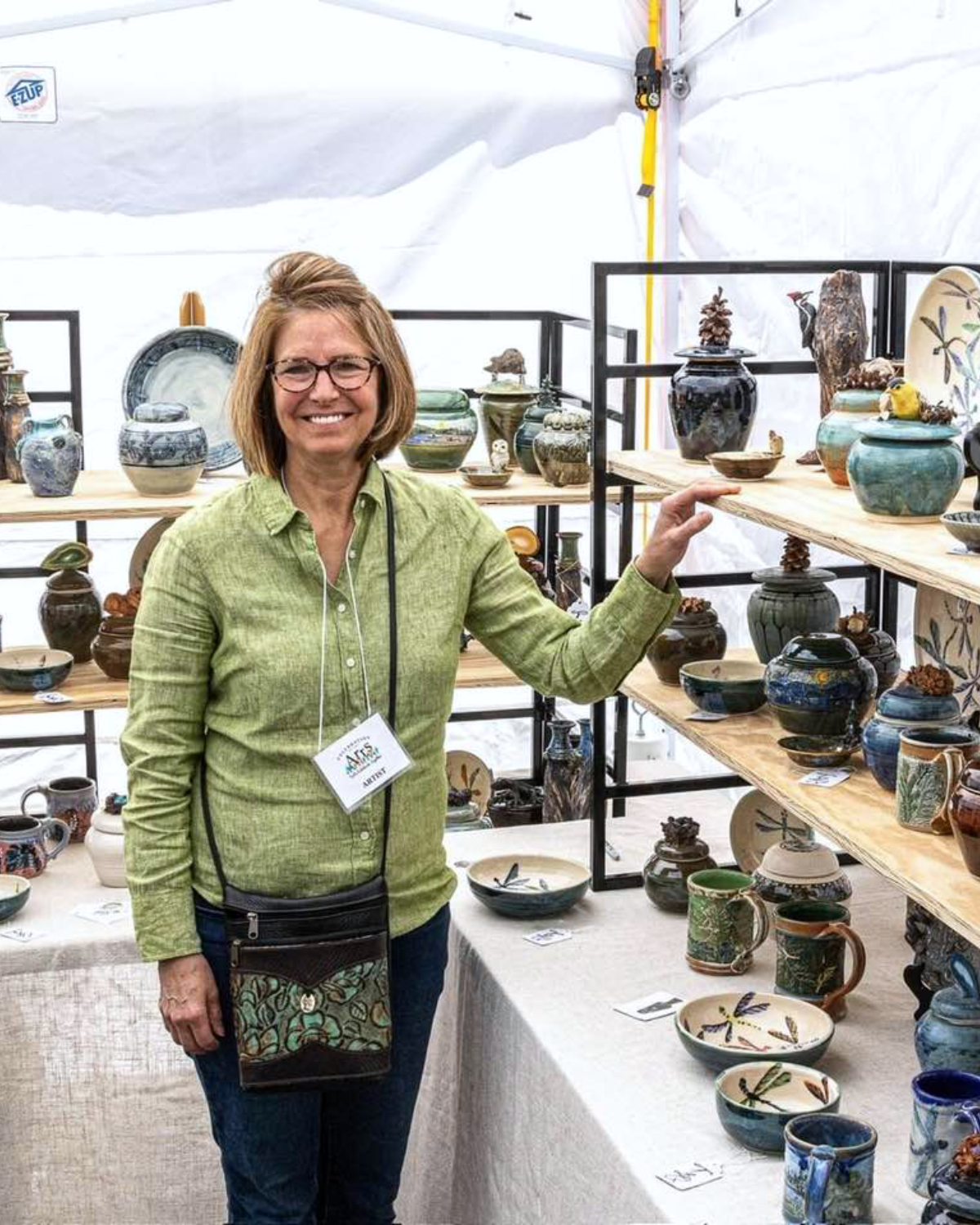 Tammy Quigley Rosenow showcasing her potter at an event.
